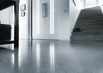 Smooth polished concrete floor in modern interior, showcasing durable and stylish flooring solutions by Precision Polished Concrete Perth.