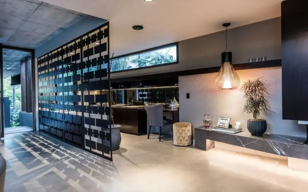 Polished concrete floor inside modern Perth home with sleek design and decorative lighting.